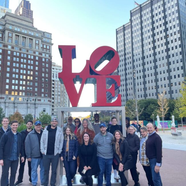 Team Photo in front of Love Statue
